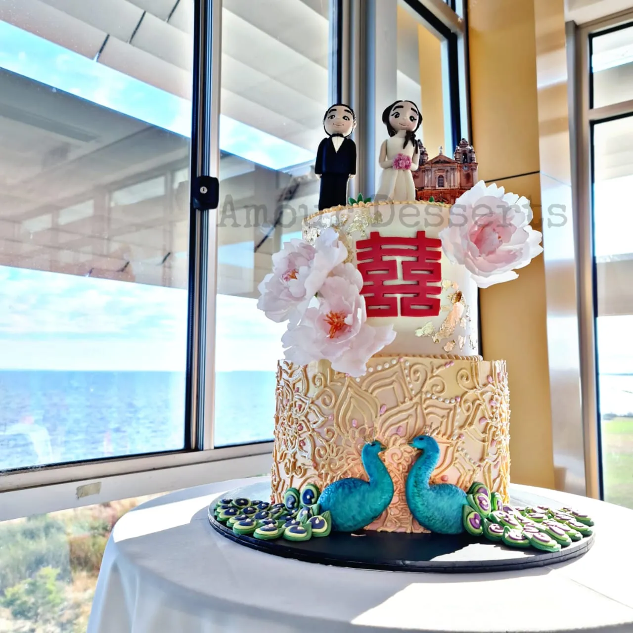 Custom cake with peacock and peony details